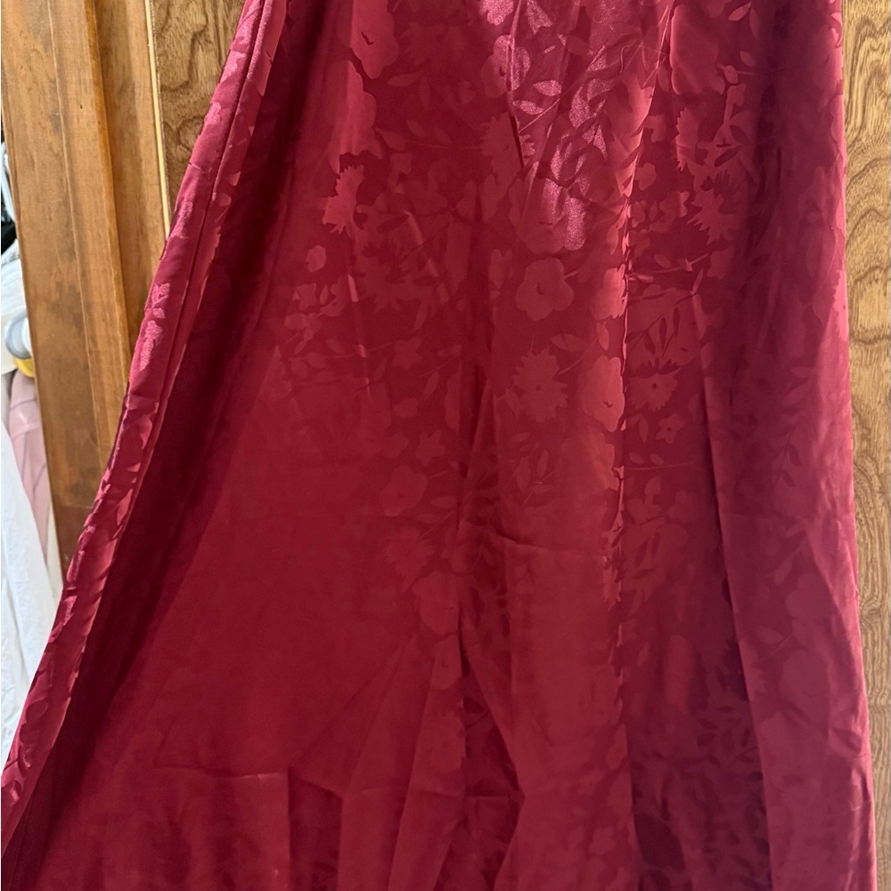 Urban Outfitters burgundy silk skirt with floral pattern.